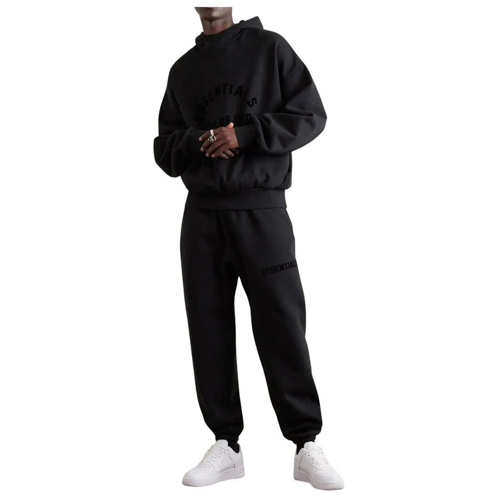 
                  
                    Fear Of God Essentials Jet Black Arch Logo Tracksuit (SS23)
                  
                